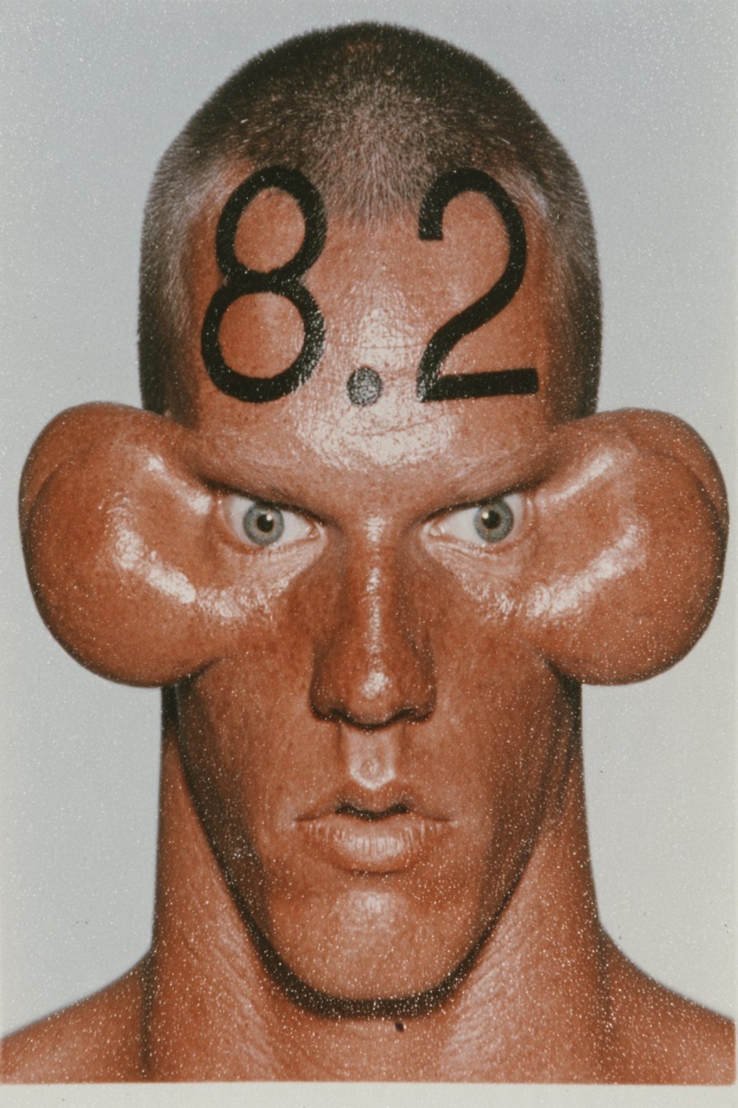 8.2 on a forehead, yearbook style
